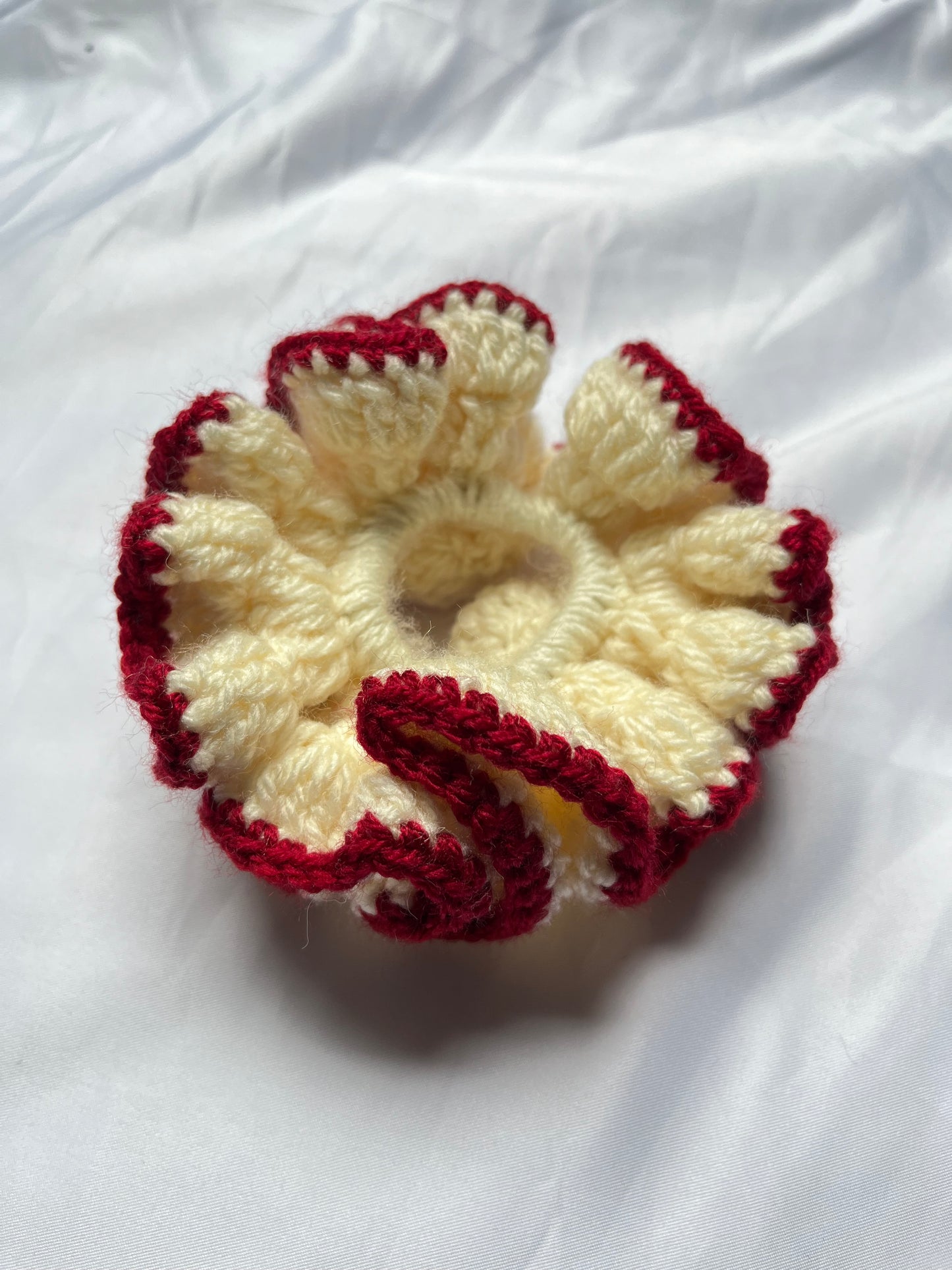 Medium creme and deep red coloured scrunchie