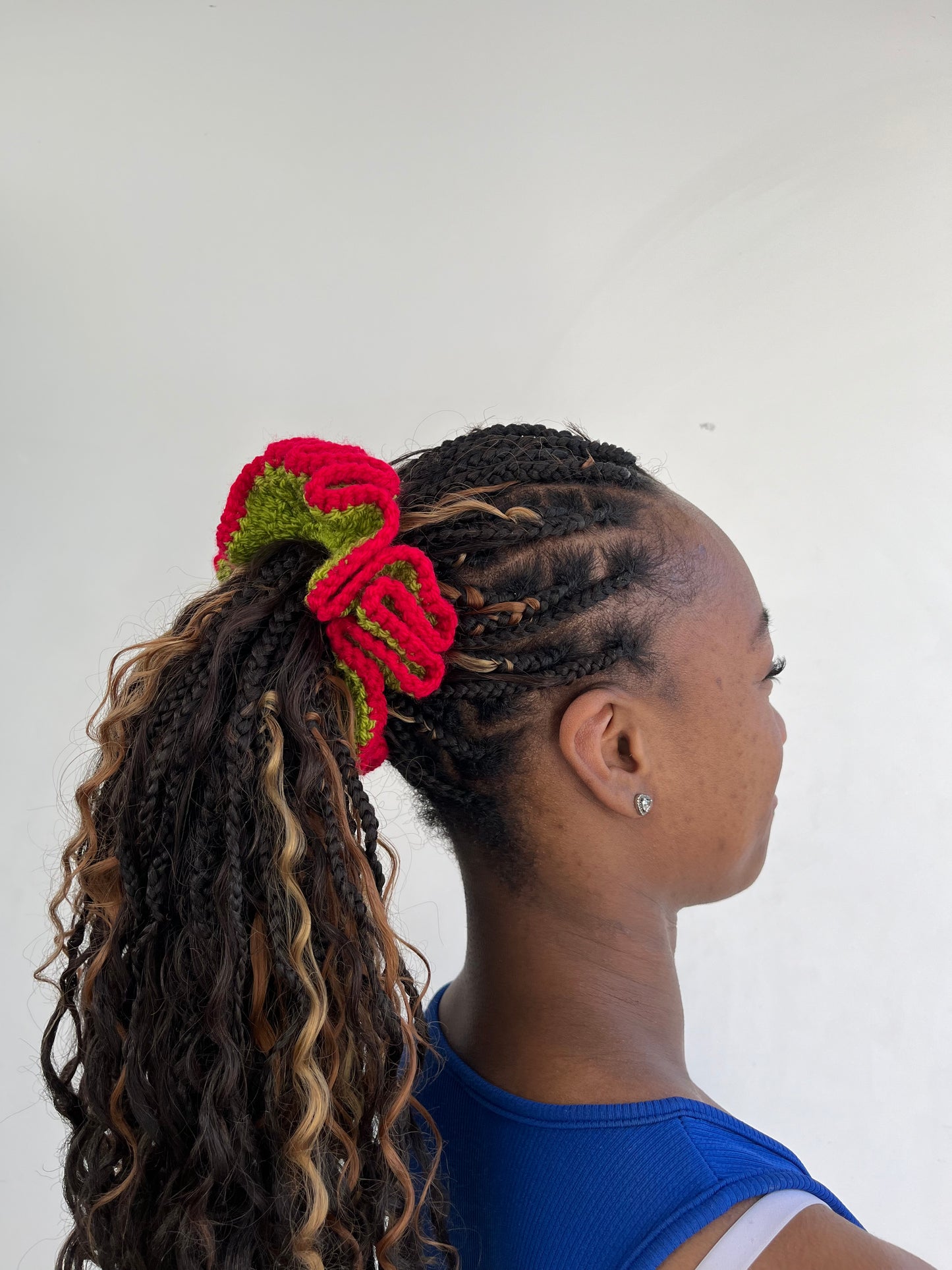Medium vibrant red and green coloured scrunchie