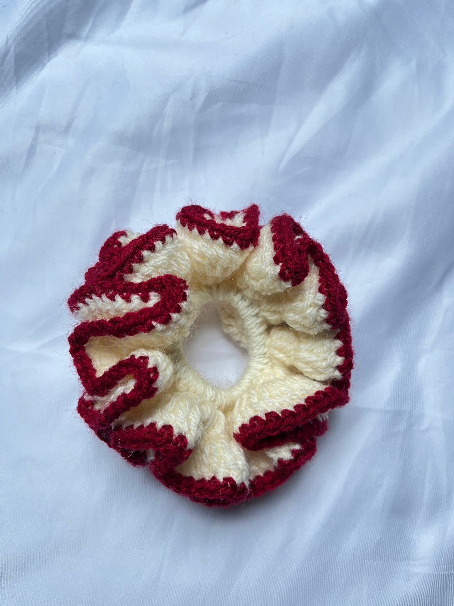 Medium creme and deep red coloured scrunchie