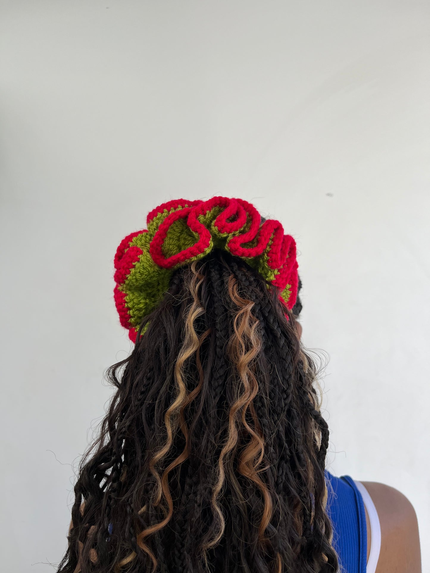 Medium vibrant red and green coloured scrunchie