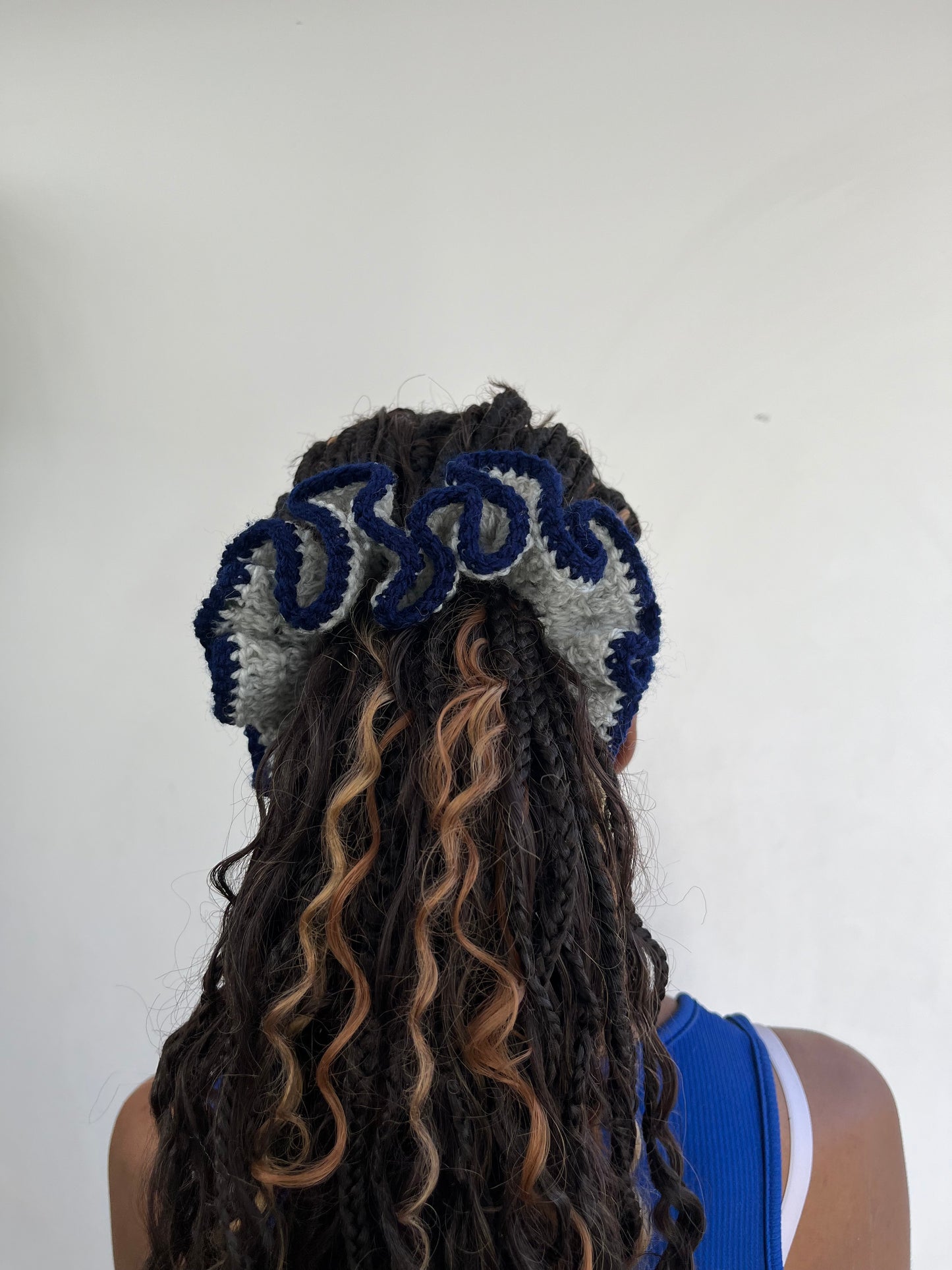 Medium navy and light grey coloured scrunchie