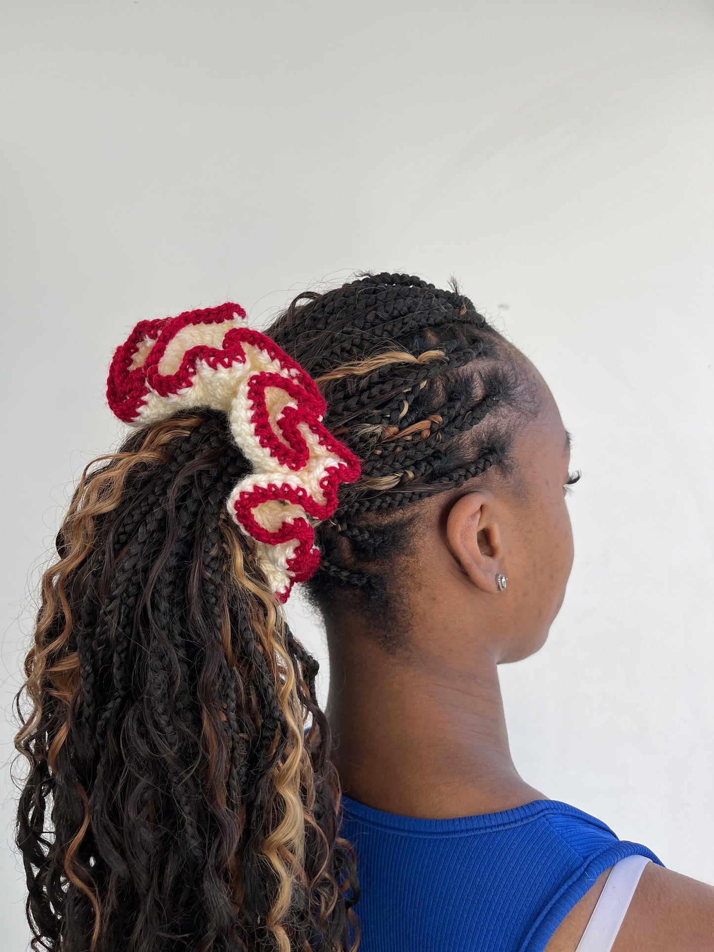 Medium creme and deep red coloured scrunchie